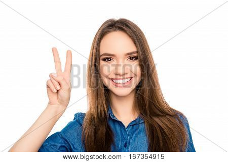 Portrait Of Cheerful Happy Brunette Woman Showing Two Fingers