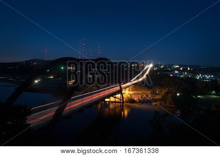 A timelapse view of an Austin Texas landmark the 360 Pennybacker Bridge at night.