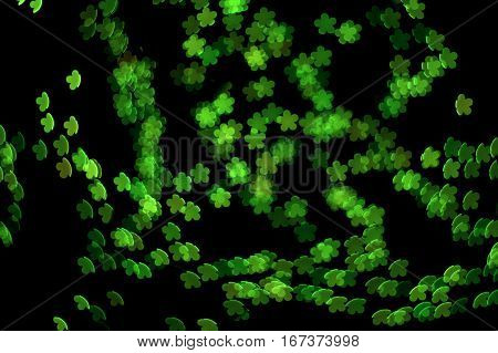Kelly Green Five Leaf clover bokeh effect dark black background