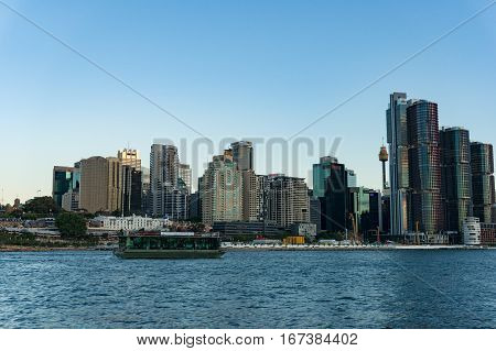 Sydney Cbd Cityscape With Barangaroo Point And Koala Cruises Boat With Tourists At Dusk