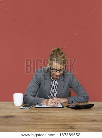 Businesswoman writing down a plan and strategy