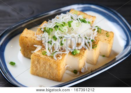studio shot of tofu cutlets with boiled whitebaite