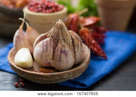 French garlic and red hot chili cayenne peppers dried variety - spicy ingredient on wooden table