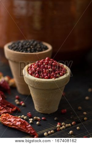 Red hot chili cayenne peppers dried variety - spicy ingredient on wooden table