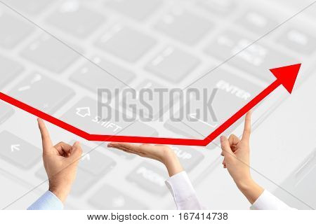 The perks of teamwork suggested by a growth arrow going up, held by three business people's hands on technology motif background