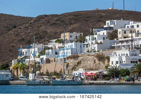 MILOS, GREECE - SEP 26, 2016: Views of the Marina from the sea. The island is famous for the statue of Aphrodite (Venus de Milo, now in the Louvre) Land area of island is 160.147 square kilometres.