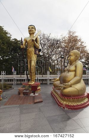 Big Gold Buddha sits and silently watches vanity below