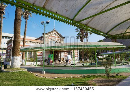 ARICA, CHILE - OCTOBER 20, 2013: View to the city park and the old Customs building in Arica, Chile.