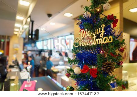 SHENZHEN, CHINA - CIRCA DECEMBER, 2016: Christmas tree at a McDonald's restaurant. McDonald's is an American hamburger and fast food restaurant chain.