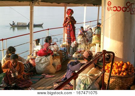 River Ayeyarwady Myanmar - 20 January 2010: people on the deck of a passenger ship on the river Ayeyarwady on Myanmar