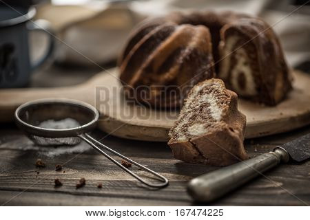 Cake. Marble cake cup of coffee powder sugar kitchen vintage utensil and fresh fruit berries.