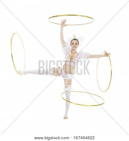 A gymnast standing twirling a hula hoop on white background. Studio photography of circus performers.