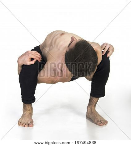 Extraordinary gymnast on a white background. The man with no bones. Studio photography of circus performers..