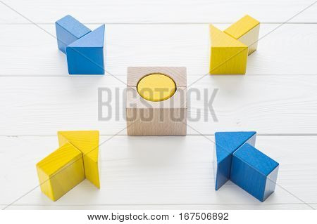 Symbol of goal and objective. Four wooden arrows converge towards the center target. Arrows pointing to the object. Business concept. The concept of the goal the implementation of the planned success