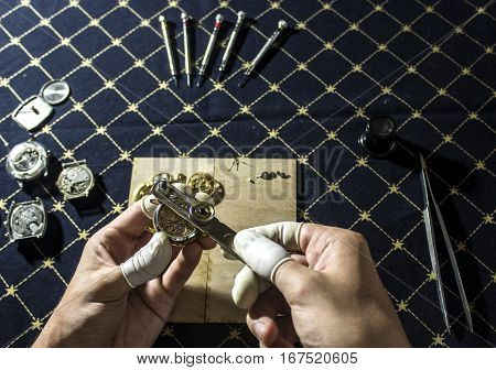 The procces of watch repair with the special tools