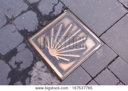 Saint James way shell golden metal on streets soil stone floorNajera La Rioja Spain