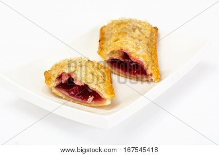 Puff pastry with fresh cherries on a white background