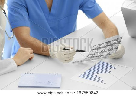 Doctor exploring roentgenogram, closeup