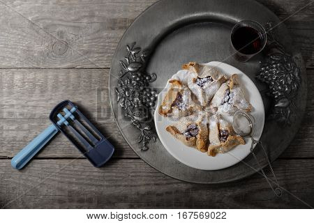 Jewish Pastry Hamantaschen and ratchet for Purim Holiday