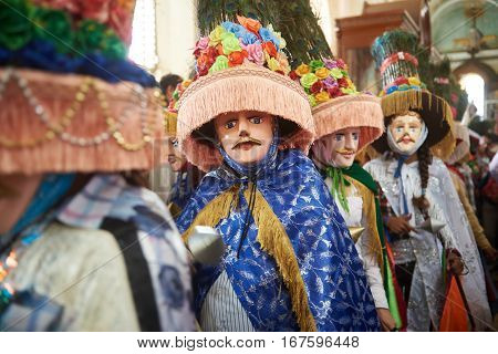 People In Big Colorful Mask