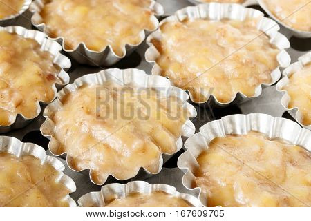 Steamed banana cake in stainless cups - Thai dessert