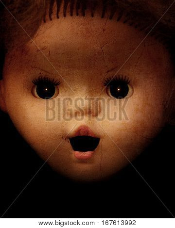 Grunge background with vintage evil spooky doll face and stucco texture