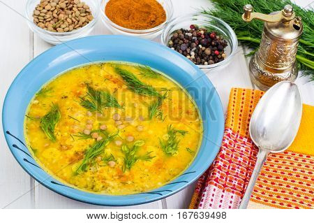 Pea soup with vegetables and dill on a white background. Studio photo