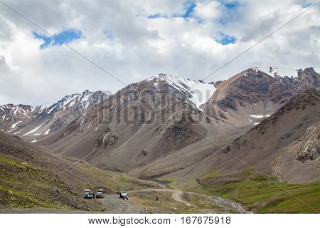 Beaultiful mountain landscape with cars and road