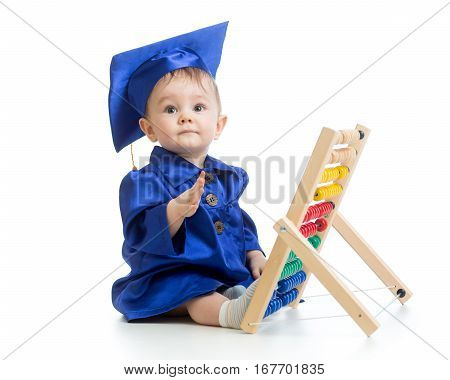 Child dressed in academic clothes with counter. Early learning baby.