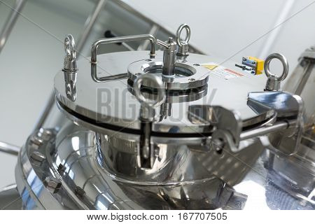 big chromed compression cap in pharmaciutical factory
