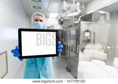 Medical Worker Is Showing The Empty Tablet, Blured Background