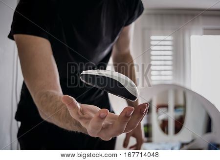 Flying computer mouse (Guy trowing computer mouse in the air)