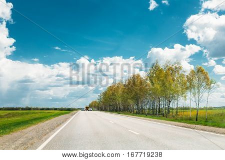 Beautiful Asphalt Freeway, Motorway, Highway Against Background Of Eastern European Landscape. Travel Road And Transportation Concept. Sunnny Day With Blue Sky.