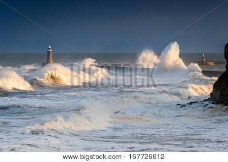 Rough Sea at Tynemouth, as stormy sea hits Tynemouth North Pier, resulting in high crashing waves cascading into the mouth of the River Tyne