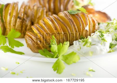 Plate with boiled potatoes, cream cheese, cucumber and linseed oil Boiled potatoes with herb quark healthy eating