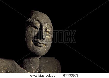 Traditional carved statue of an enlightened buddhist monk