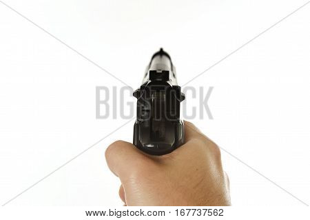 male hand holding gun aiming in subjective point of view POV isolated on white background in fire weapon use and war crime and violence concept