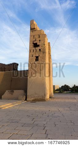Ruins of an ancient temple of Egypt with statues and columns