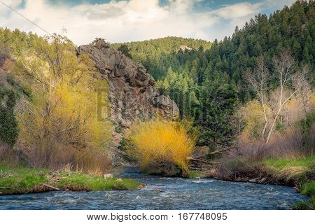 Landscape a of river flowing into mountains.