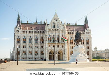 Budapest, Hungary - June 16, 2016: Tourist Looking Around Near Hungarian Parliament Building In Buda