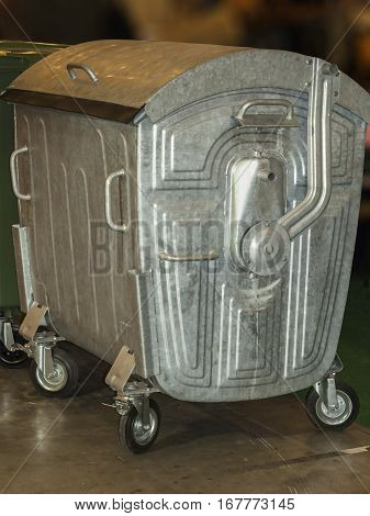 Metal tank to collect garbage in the stands wheels