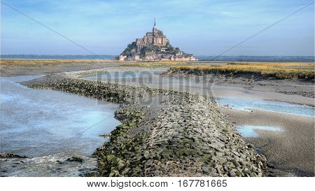 Panoramic view on Mont-Saint-Michel and a river channel Couesnon, Normandie France