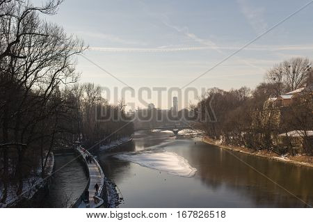 MUNICH - JANUARY 28: View on a city center from the bridge on river Isar in Munich Germany. View on St. Luke's Church - the largest Roman Catholic church in Munich southern Germany