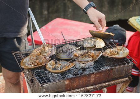 Grilled horseshoe crabs in Thai marketThai street food
