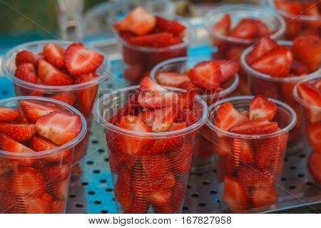 Fresh ripe strawberries in a glassine Thai market