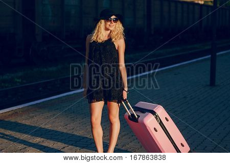 beautiful girl at raiway station. uses communication