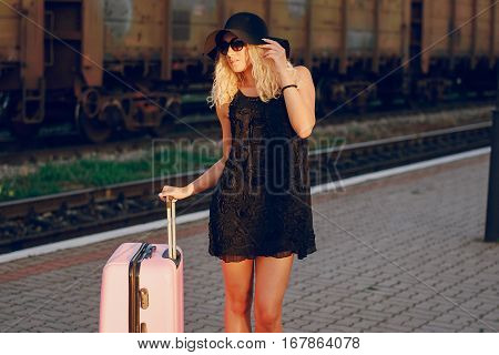 beautiful girl at raiway station. uses communication