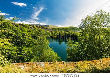 Looking across the disused Cornwall Slate Quarry Nantlle Gwynedd Wales United Kingdom. Flooded with water.