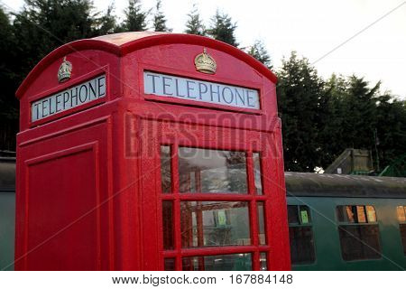 Alresford, Uk - Jan 28 2017: Vintage British Telephone Box And Railway Carriages At Alresford Statio
