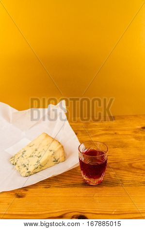 Glass Of Sloe Gin With Stilton Cheese